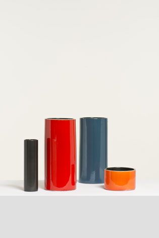 collection of cylindrical glazed earthenware vases