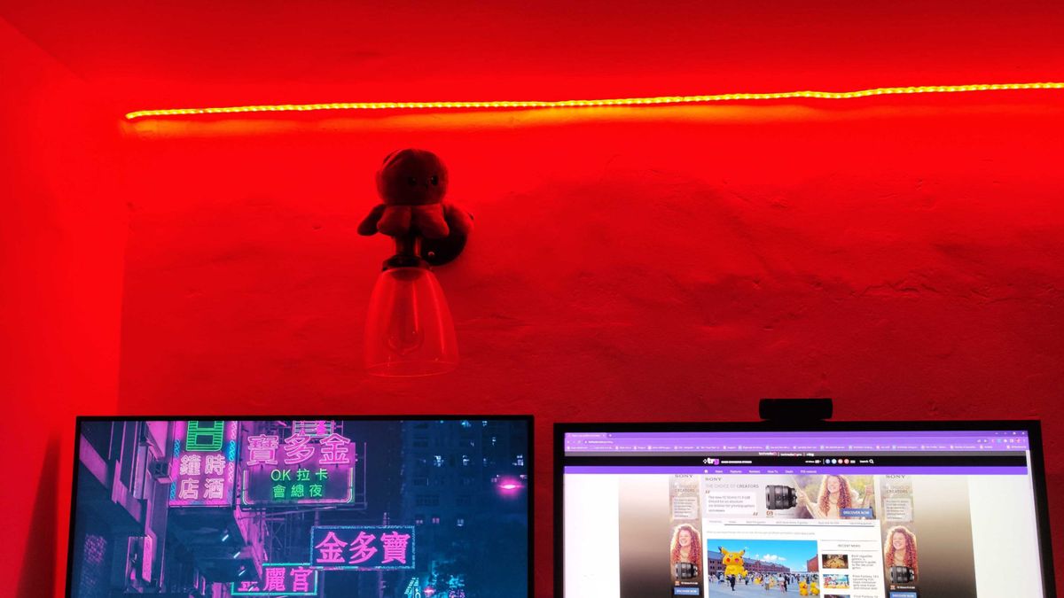 A workspace lit by a smart light in red