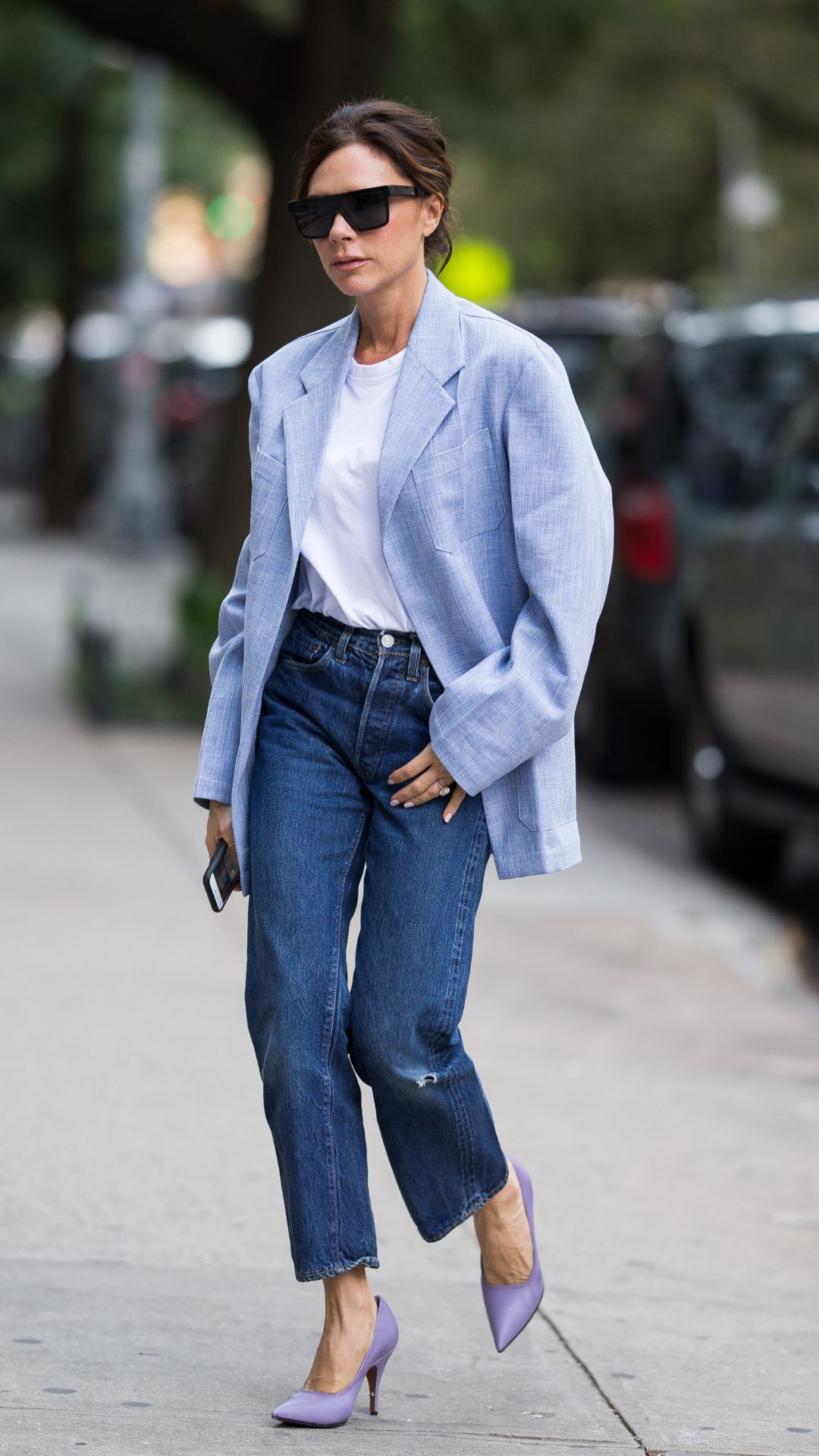 victoria beckham wearing a blazer and jean outfit