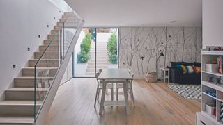 A basement conversion with a staircase leading down to it