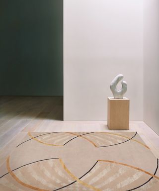 Deirdre Dyson carpet art rug with sculpture behind