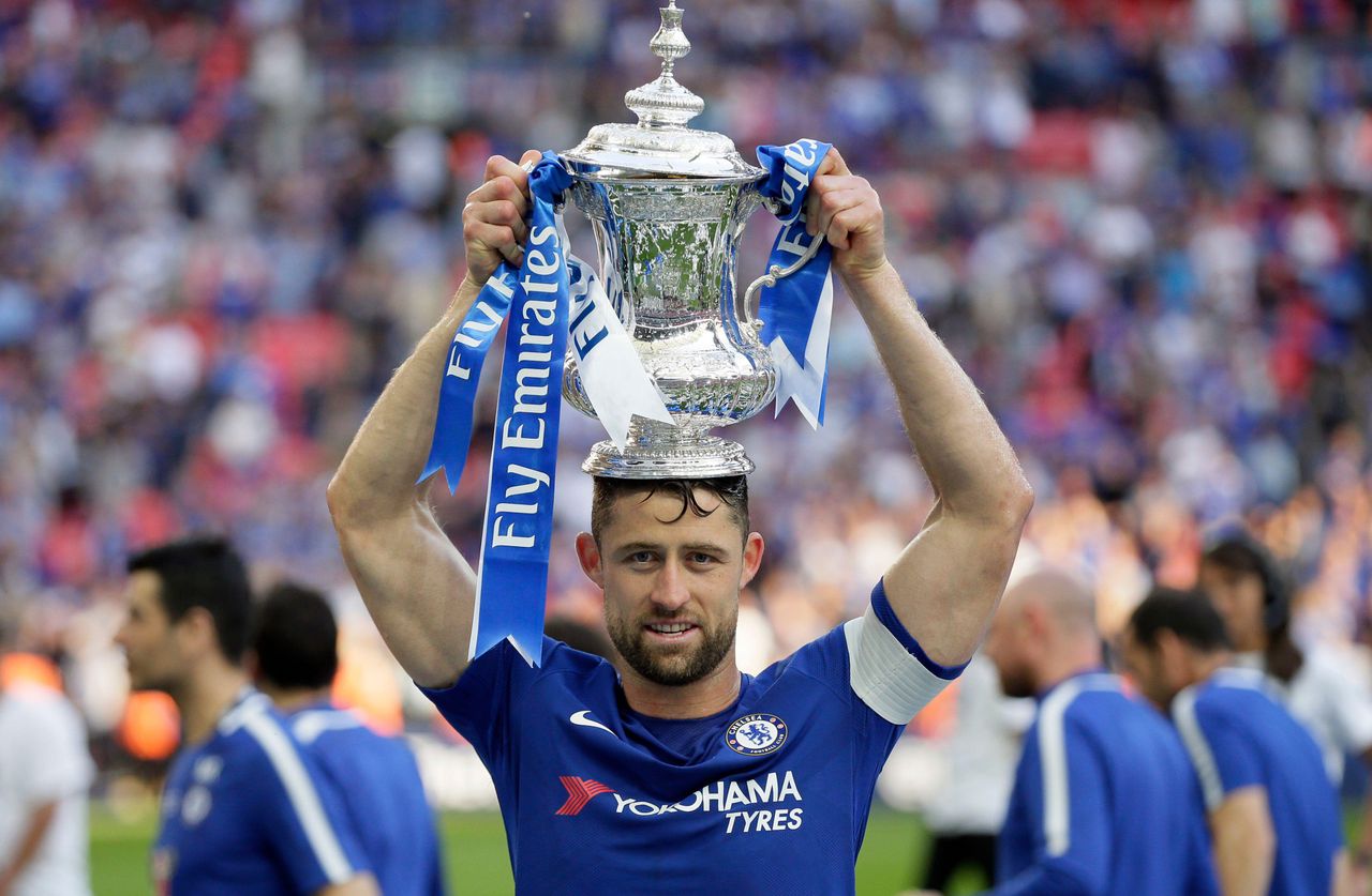 Chelsea captain Gary Cahill celebrates with the FA Cup on his head, May 2018