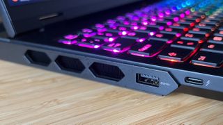 Close up on left-hand ports of the Lenovo Legion Pro 7i Gen 9, with a Thunderbolt 4, USB-A, and air vents visible