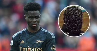 Bukayo Saka of Arsenal applauds the fans after the Premier League match between Liverpool FC and Arsenal FC at Anfield on April 09, 2023 in Liverpool, England.