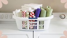  picture of dry laundry in a basket on top of a washer dryer to suggest a laundry drying mistake