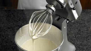 KitchenAid stand mixer being used to mix batter