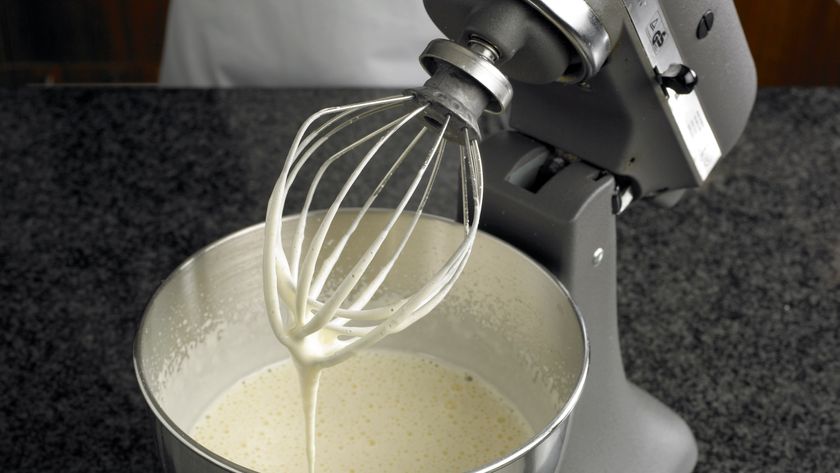 KitchenAid stand mixer being used to mix batter