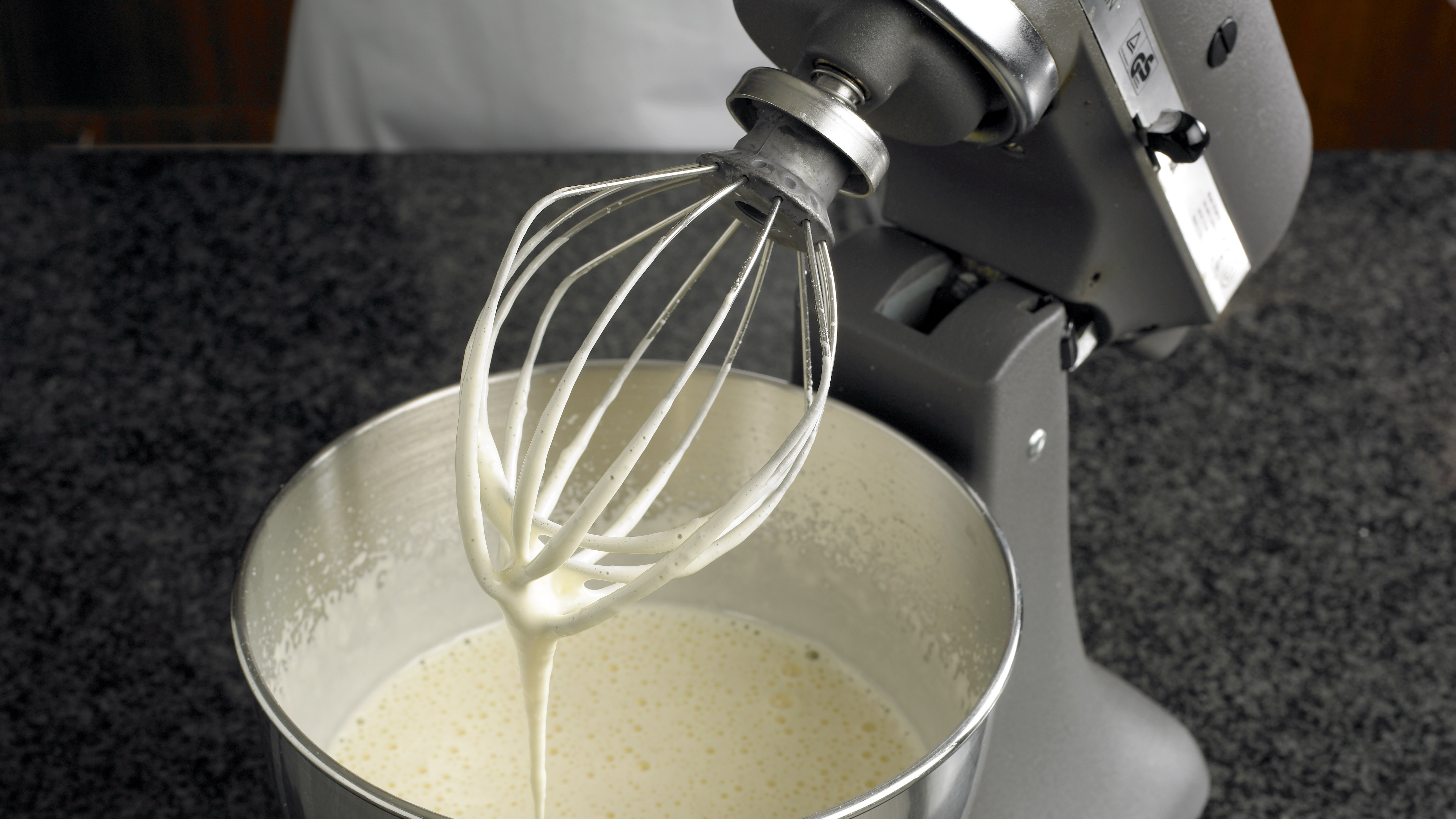 KitchenAid stand mixer being used to mix batter