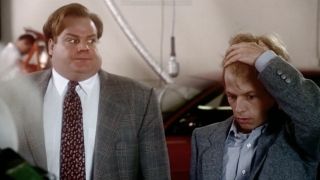 Tommy looking awkwardly at Richard who's holding his hair in Tommy Boy.