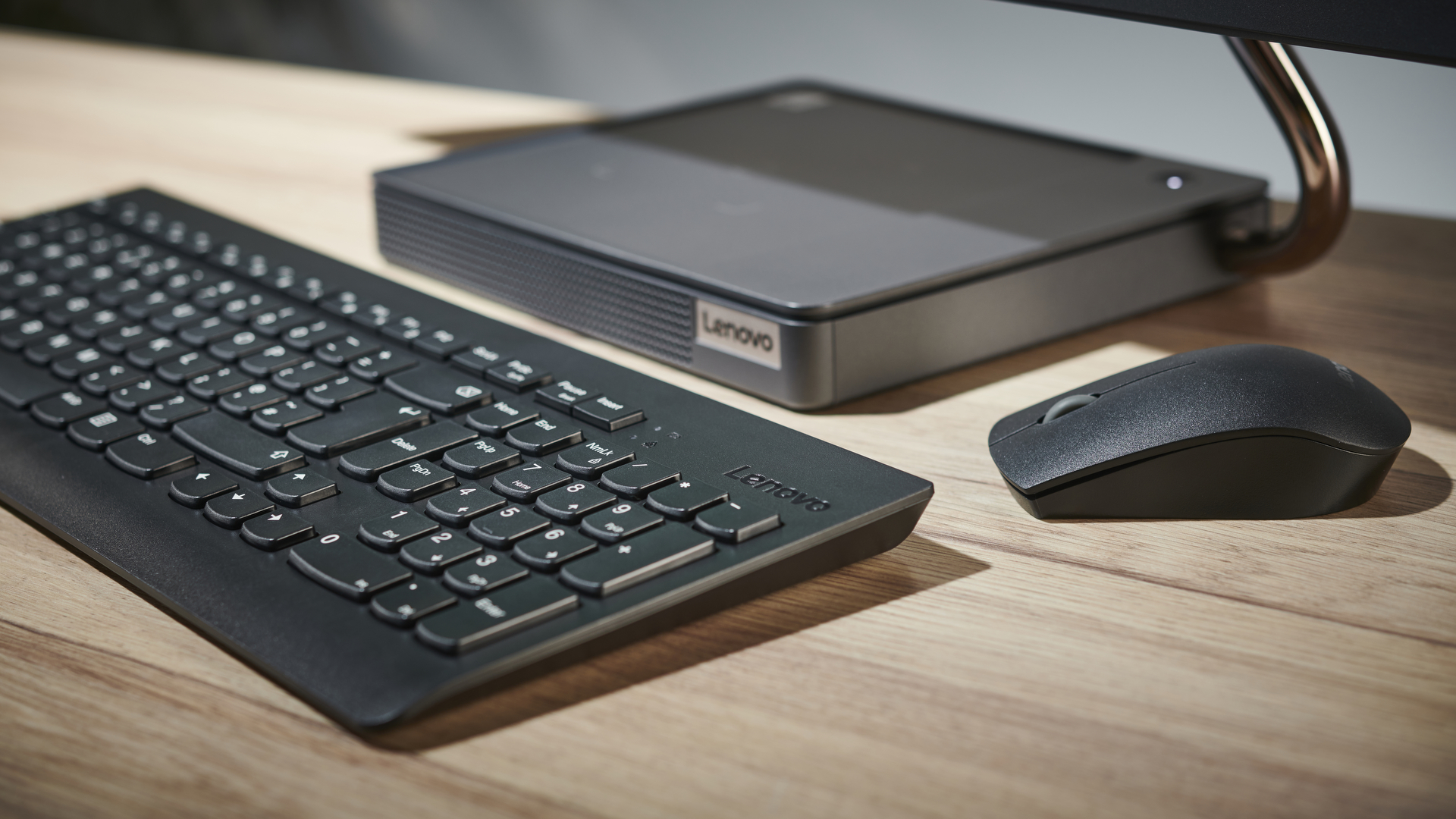 Lenovo IdeaCentre AIO 5 all-in-one PC on a desk in an office close up of keyboard and mouse