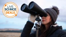 woman using the Celestron SkyMaster 15x70 binoculars