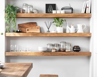 Floating shelves pictured in a kitchen