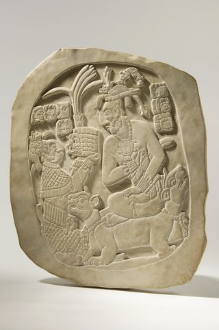 A stone tablet from Palenque shows K’inich Janaab Pakal receiving the crown from his mother, Ix Sak K'uk.