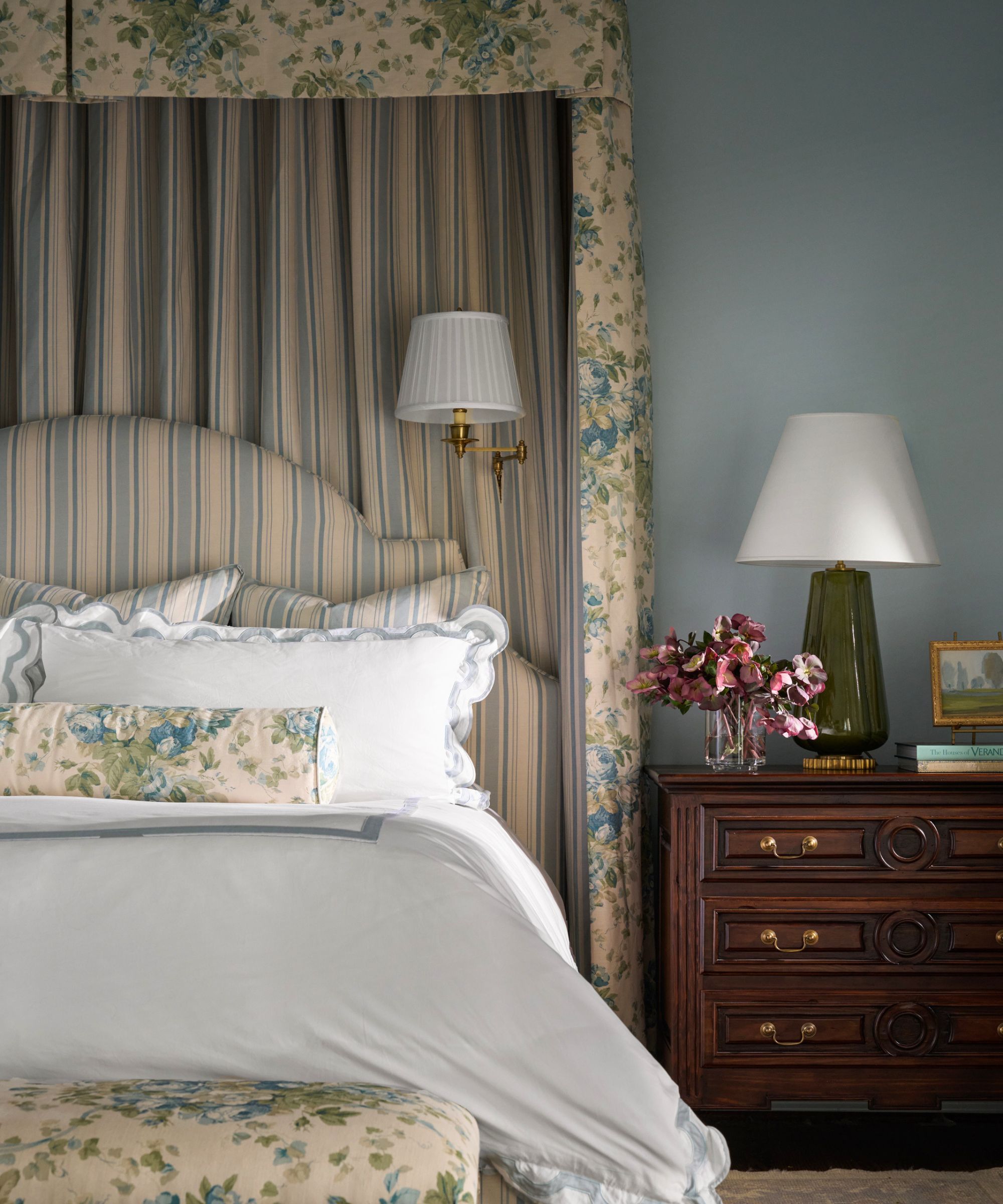 Bedroom design by Katie Davis Design featuring a bed with a chintz floral and stripe bed canopy , photograph Nathan Schroder