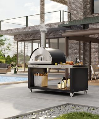 A wheelie trolley with a pizza oven next to a pool
