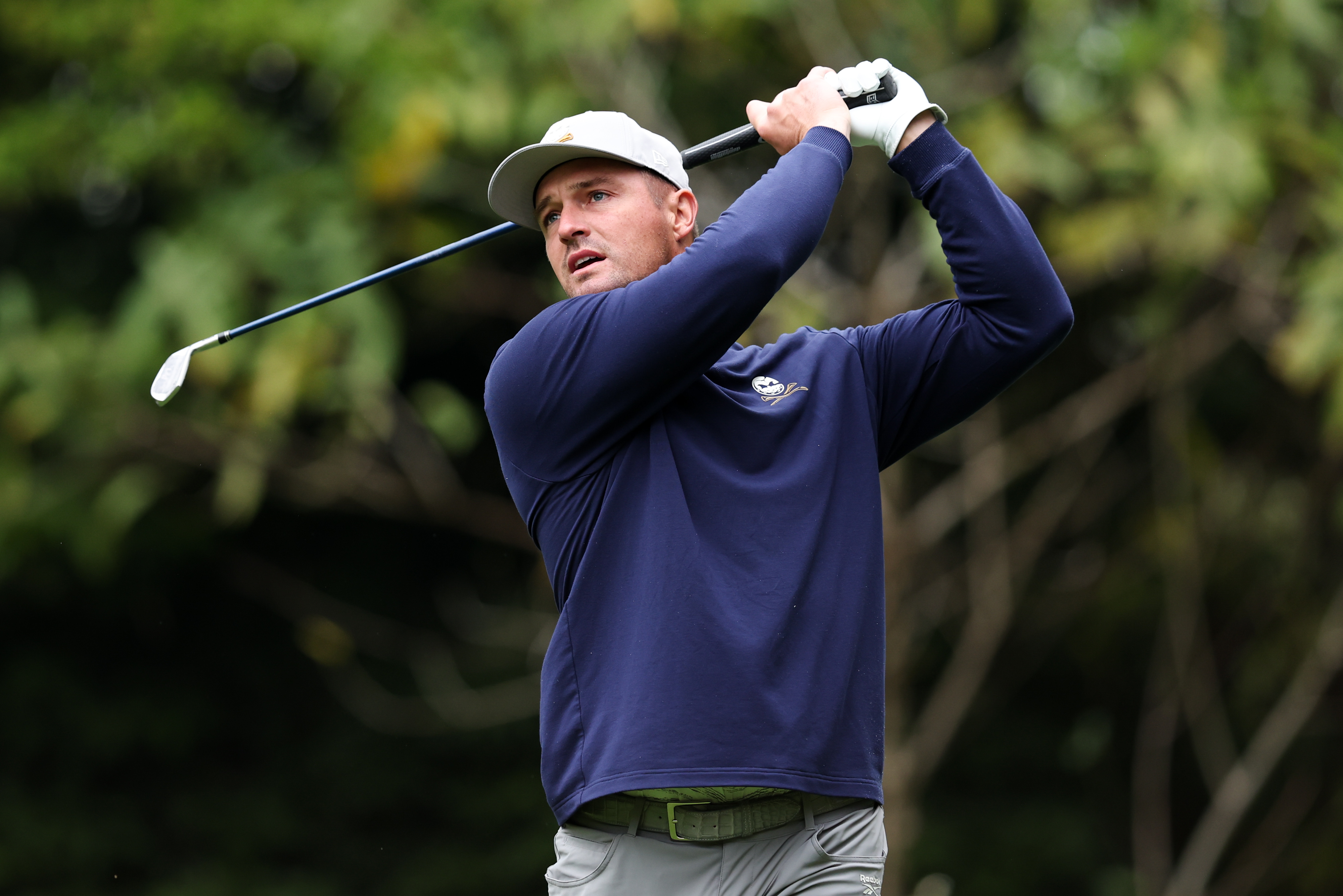 Bryson DeChambeau hitting an iron