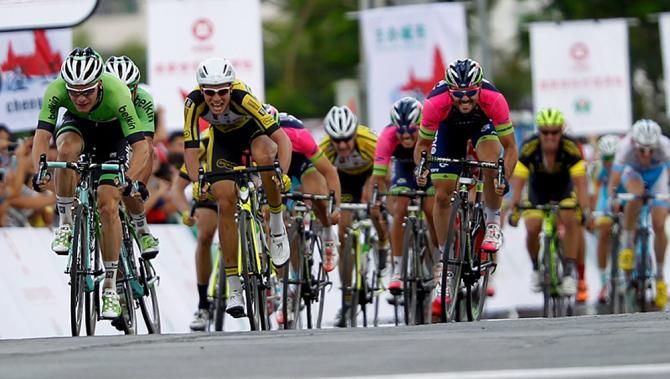 Andrea Palini (Lampre-Merida) and Ondrej Rybin (Team Dukla Praha) sprint in behind Hofland
