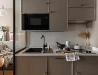 Minimalist kitchen at Wembley Ark co-living concept by Holloway Li