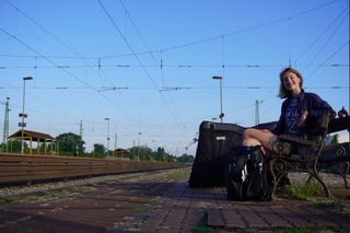 Image shows Anna waiting for the train at Budapest-Nyugati station.
