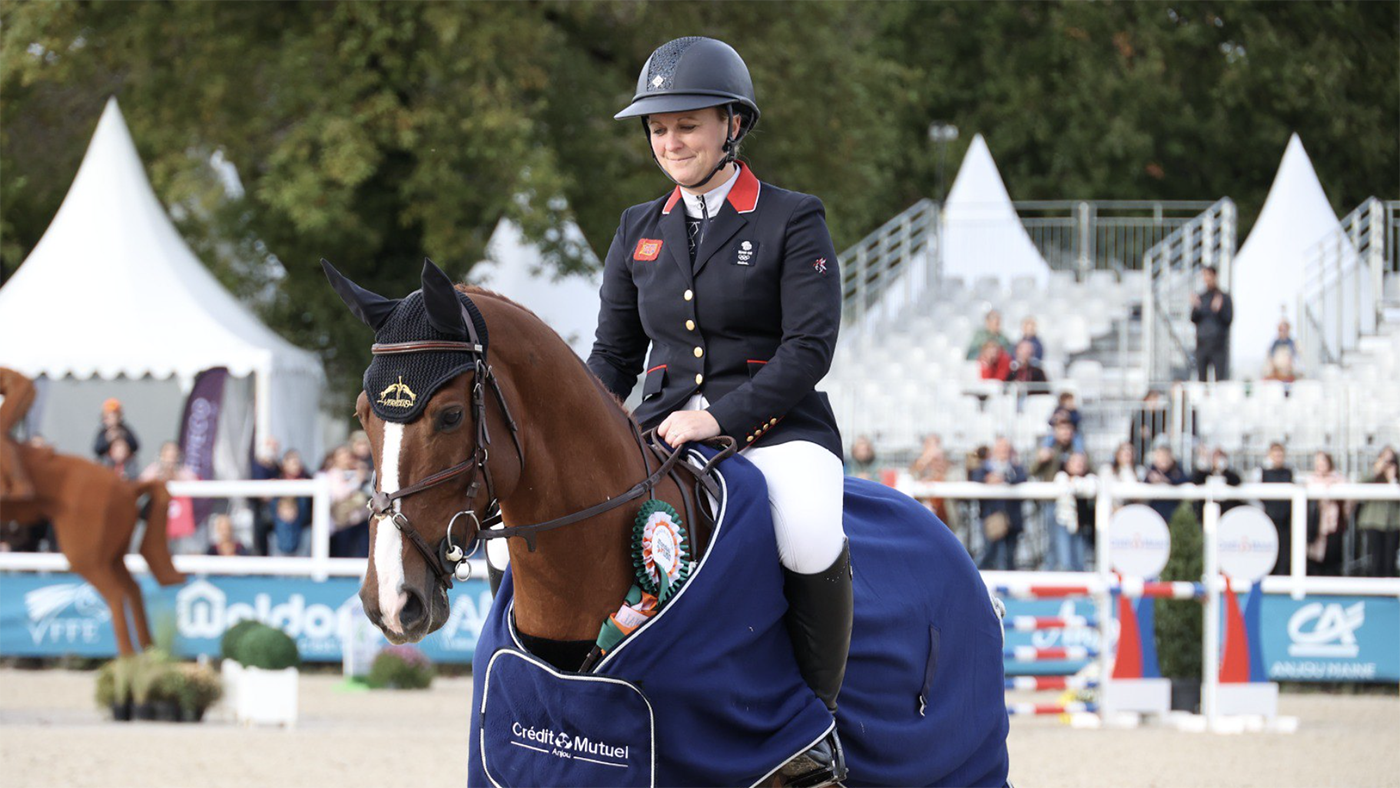 Gemma Stevens sits on Chilli Morning IV wearing his winners rug for the seven-year-old class at Le Lion.