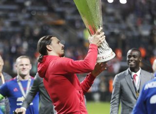 Zlatan Ibrahimovic holds the Europa League trophy after Manchester United's win over Ajax in the 2017 final in Stockholm.