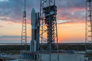 The sun sets behind a United Launch Alliance Atlas V rocket at Space Launch Complex-41 of the Cape Canaveral Air Force Station in Florida. The rocket will launch the advanced GOES-R weather satellite on Nov. 19, 2016.