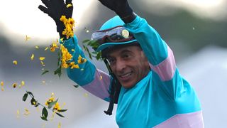 Jockey John Velazquez #1 riding National Treasure celebrates after winning the 148th Running of the Preakness Stakes at Pimlico Race Course on May 20, 2023 in Baltimore, Maryland