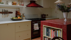 kitchen extension with light grey cabinets and a red tiled kitchen island