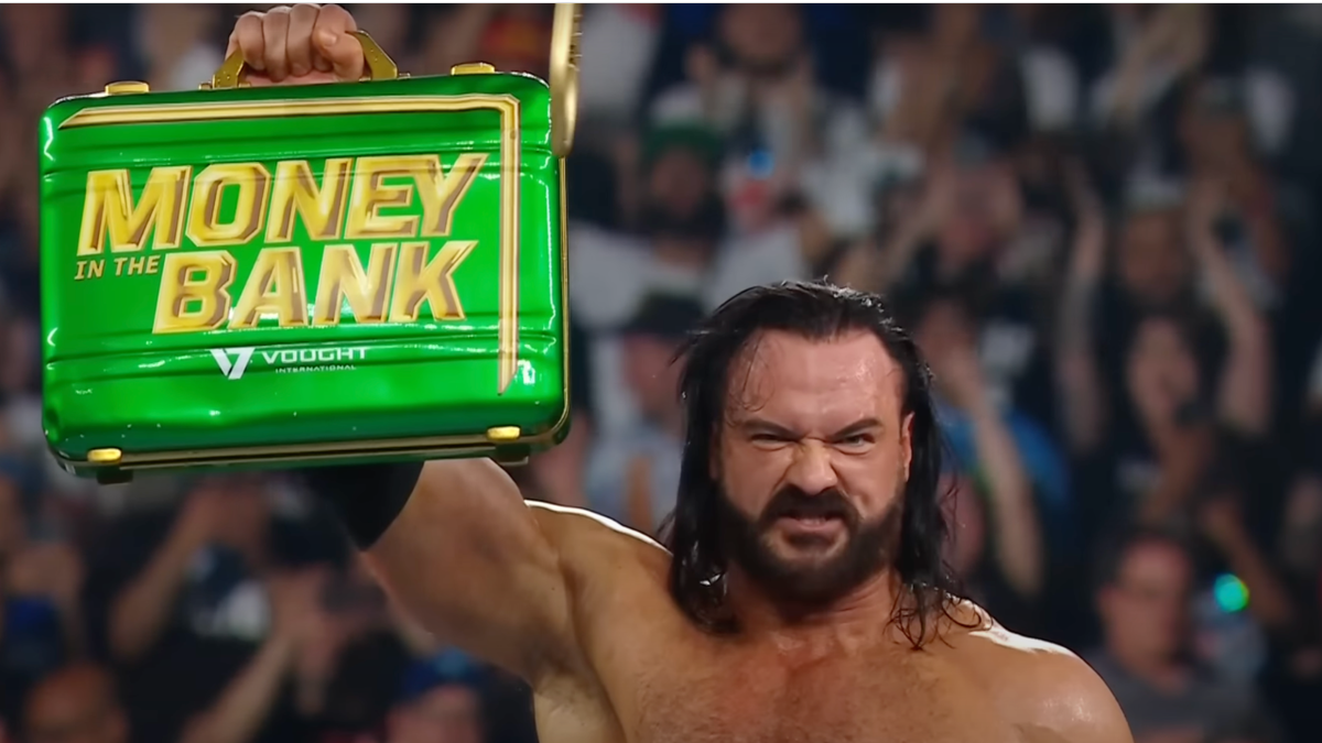 Drew McIntyre hoisting the Money In The Bank briefcase