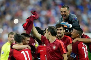 Eduardo Carvalho (top right) jumps on his Portugal team-mates after victory over France in the final of Euro 2016.