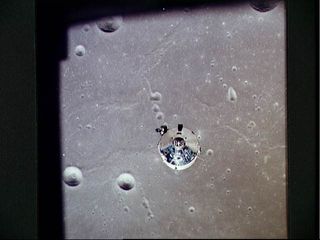 The Apollo 11 Command/Service module is photographed from the Lunar Module in lunar orbit during the Apollo 11 lunar landing mission.