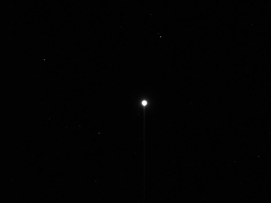 This image shows the first, unprocessed image obtained by NASA's Dawn spacecraft of the giant asteroid Vesta in front of a background of stars. It was obtained by Dawn's framing camera on May 3, 2011, from a distance of about 750,000 miles (1.2 million kilometers).