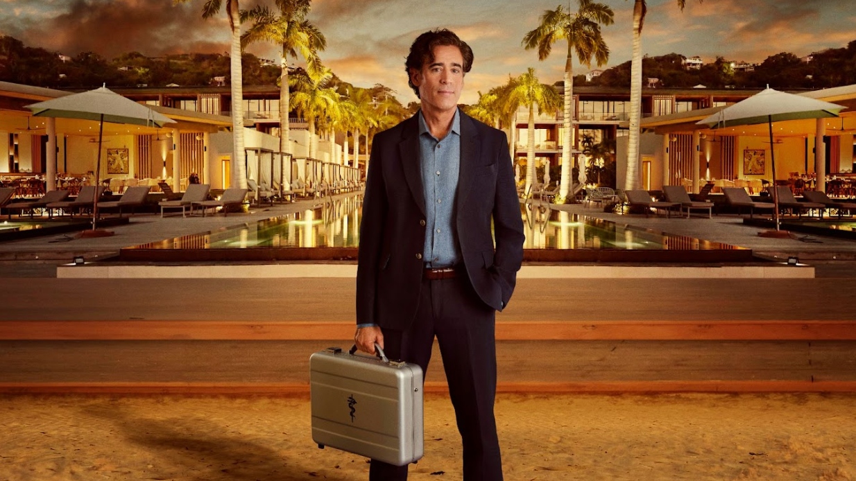 Host Stephen Mangan standing with a briefcase outside ITV&#039;s The Fortune Hotel.