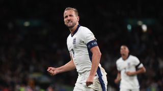 Harry Kane of England clenches his fist in celebration whilst running up the pitch ahead of the England vs Greece 2024 Nations League game