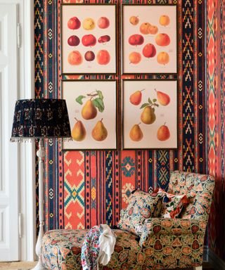 Maximalist decor wallpaper in living room with chair and artwork