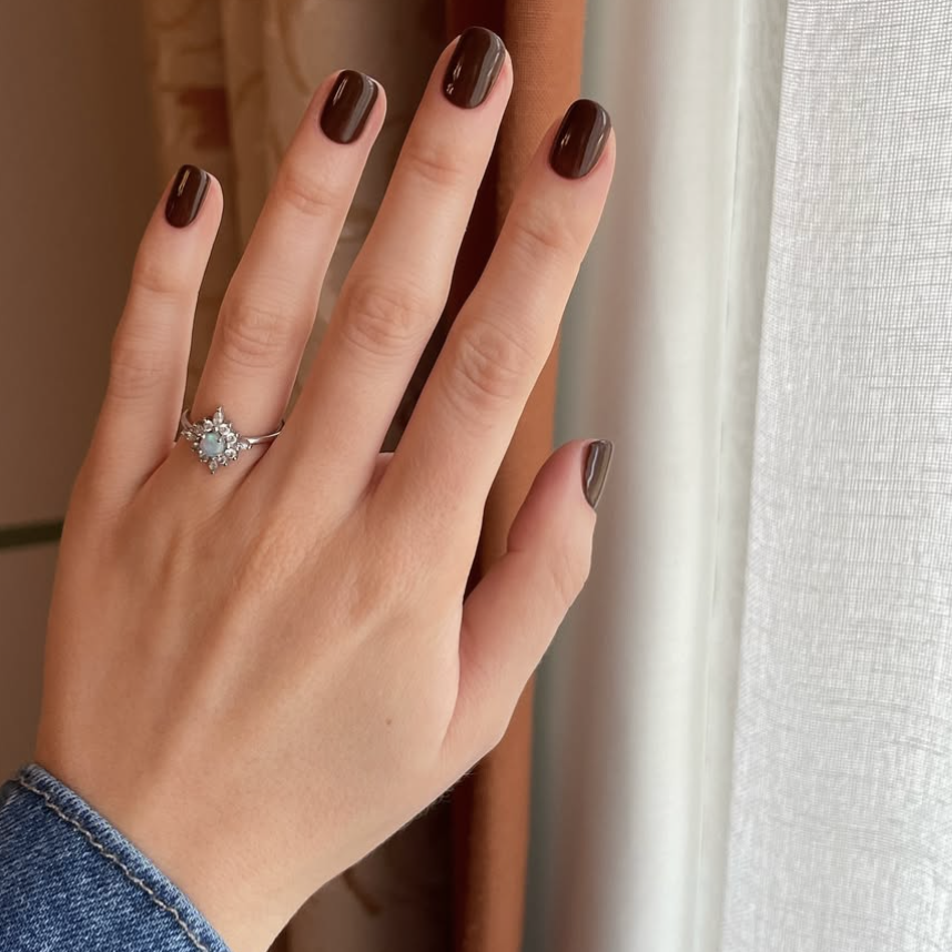 A short brown engagement manicure.
