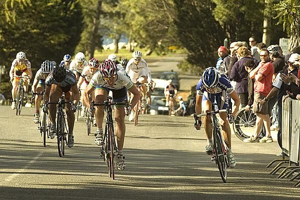 Peta Mullens (right) and Jenny MacPherson charge for the line in the finish to the womens' criterium in Geelong.