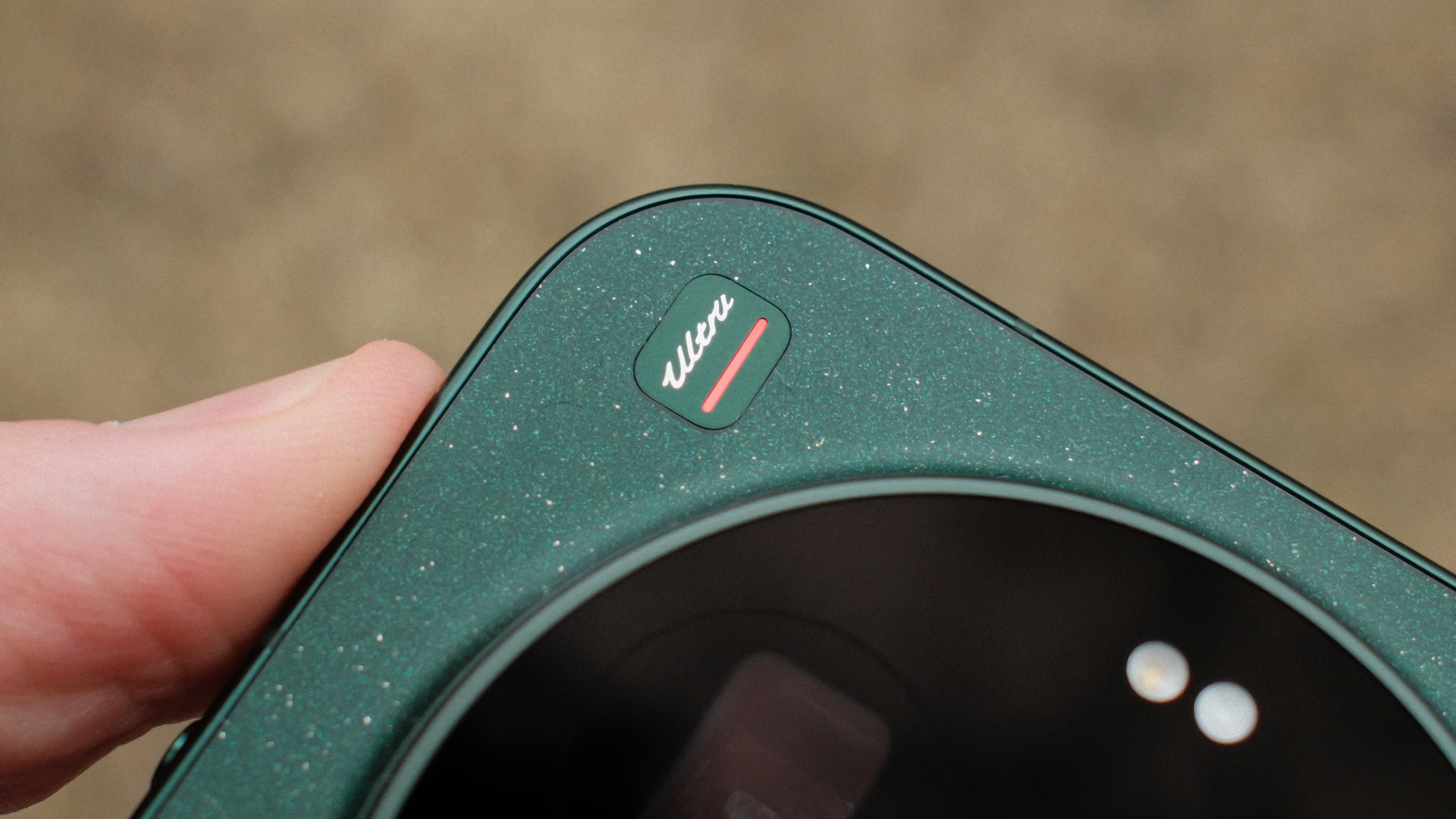 Detail of the Xiaomi 17 Ultra&amp;rsquo;s corner showing the Leica badge and textured green finish with subtle speckled effect.