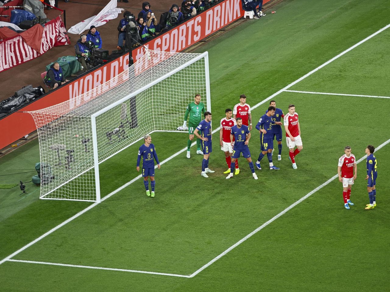 A Champions League soccer match between Arsenal and Atletico Madrid, as seen from the upper stand at the Emirates stadium, London. Zoomed in photos of the players