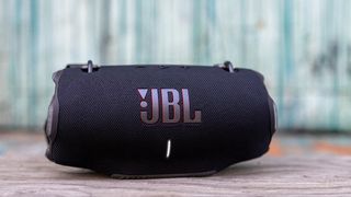 JBL Xtreme 4 in black on wooden shelf