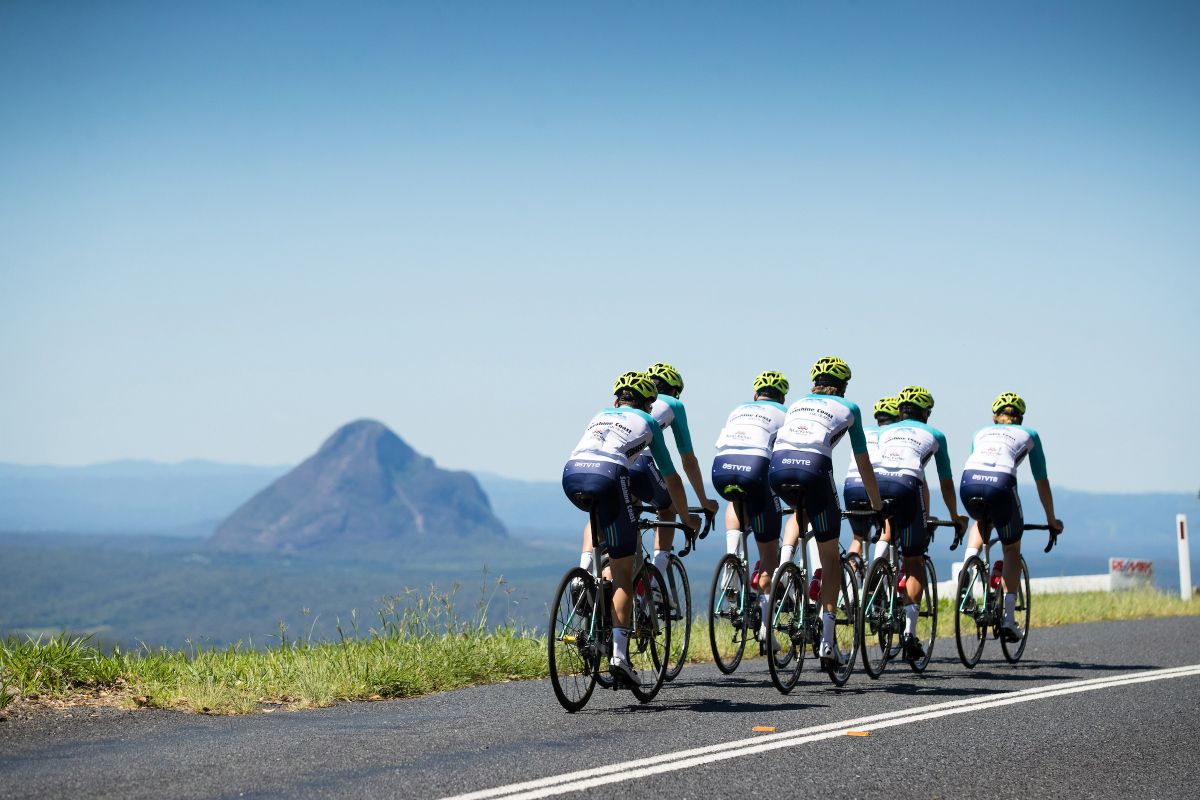 Riding past the Glass House Mountains