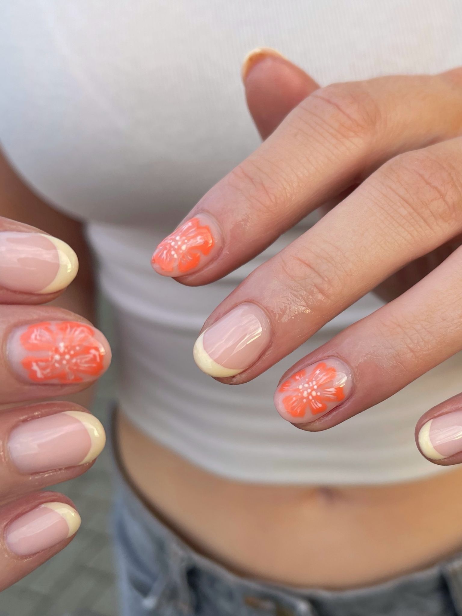 Orange floral nails by @rosetuckersouthport