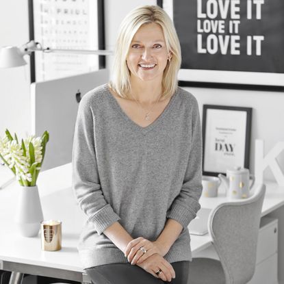 women with white table and chairs with flower pot