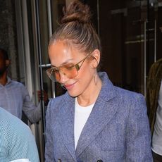 Jennifer Lopez leaves a hotel in Manhattan wearing a blue blazer and wide leg jeans