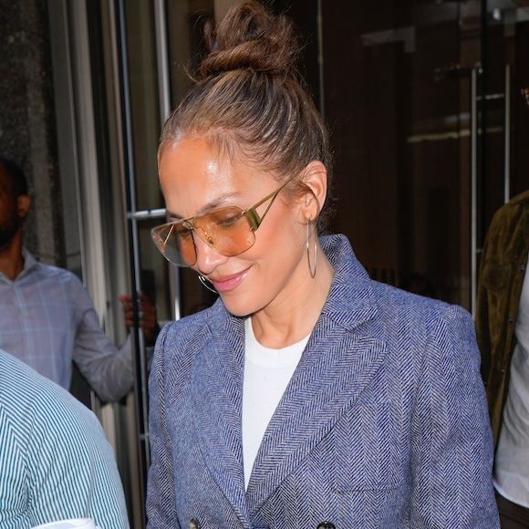 Jennifer Lopez leaves a hotel in Manhattan wearing a blue blazer and wide leg jeans