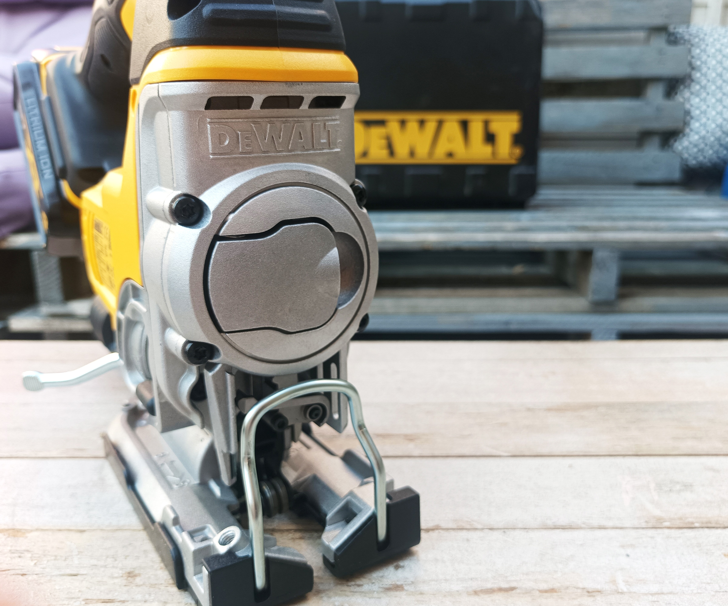 Front on shot of DeWalt DCS331N Cordless Jigsaw with DeWalt hard case in background