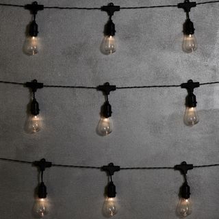 grey wall with lights on bulb