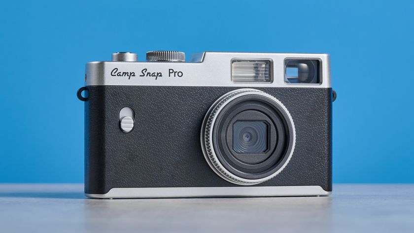 Camp Snap CS-Pro in black and silver photographed on a blue background