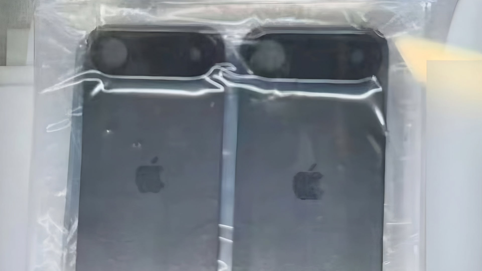 Two supposed shells of the iPhone 17 Air, depicting a camera module that runs the entire length of the back surface.