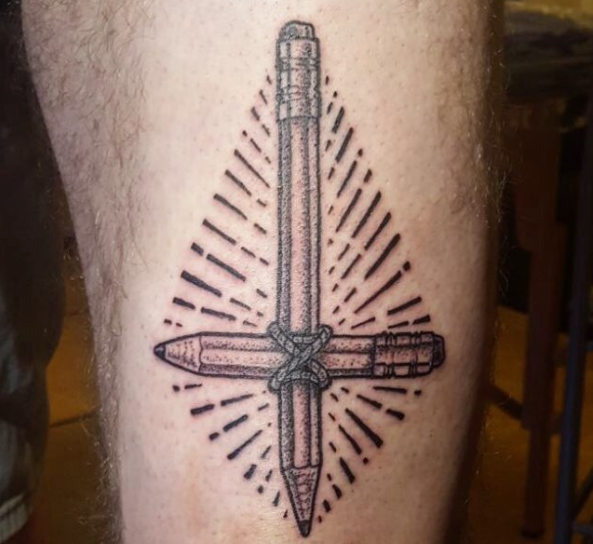 Artistic cross tattoo